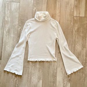 White bell sleeve turtle neck sweater
